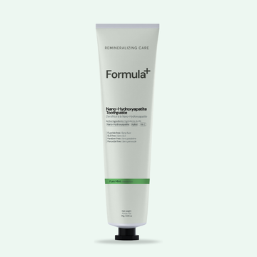 Tube of Formula+ toothpaste on a white background