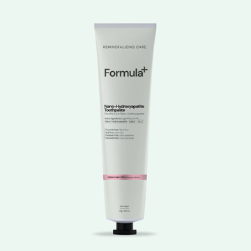 Tube of Formula+ toothpaste on a white background