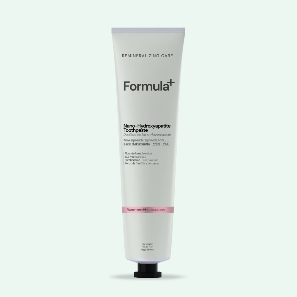 Tube of Formula+ toothpaste on a white background