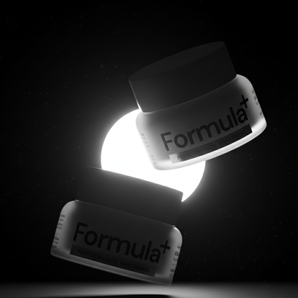 Two jars of Formula+ whitening powder on a dark background with a spotlight effect.